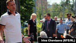 Russian opposition blogger Aleksei Navalny talks to reporters before meeting with police investigators on July 31.